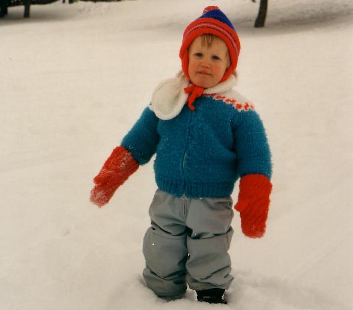 Young toddler outside in the snow.