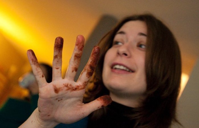 lady with chocolate on her fingerL