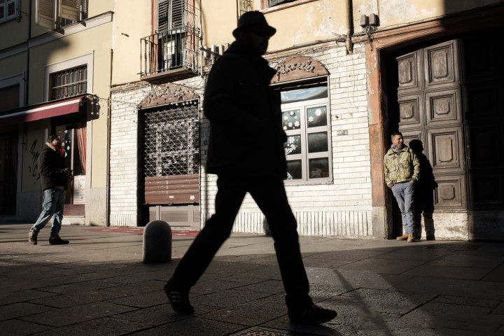 silhouette of a man walking in the street