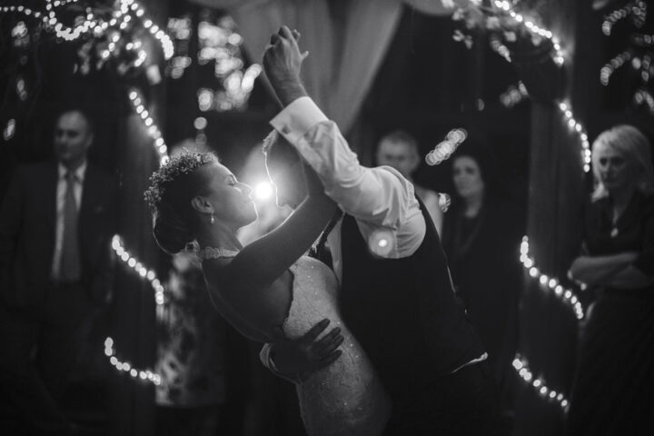 Bride and groom dancing in the evening
