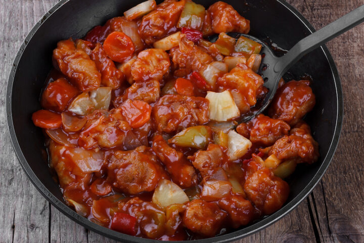 Sweet and Sour Pork in a cooking wok