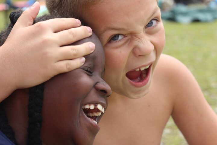 Black and white children playing