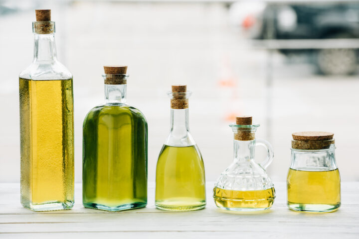 olive oil bottles on wooden table
