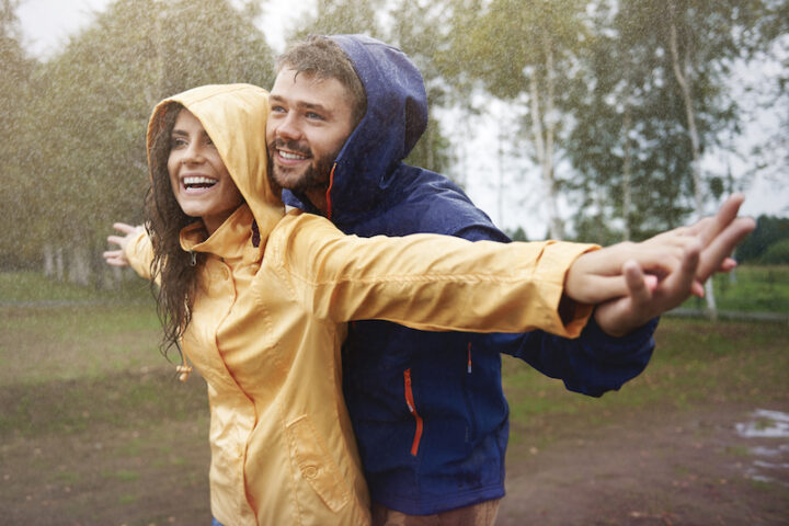 Happy couple in the rain