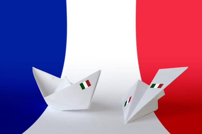 France flag depicted on paper origami airplane and boat. Oriental handmade arts concept