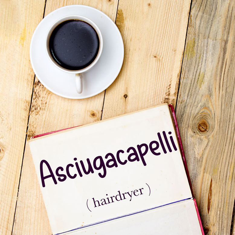 cover image with the word “asciugacapelli” and its translation written on a notepad next to a cup of coffee