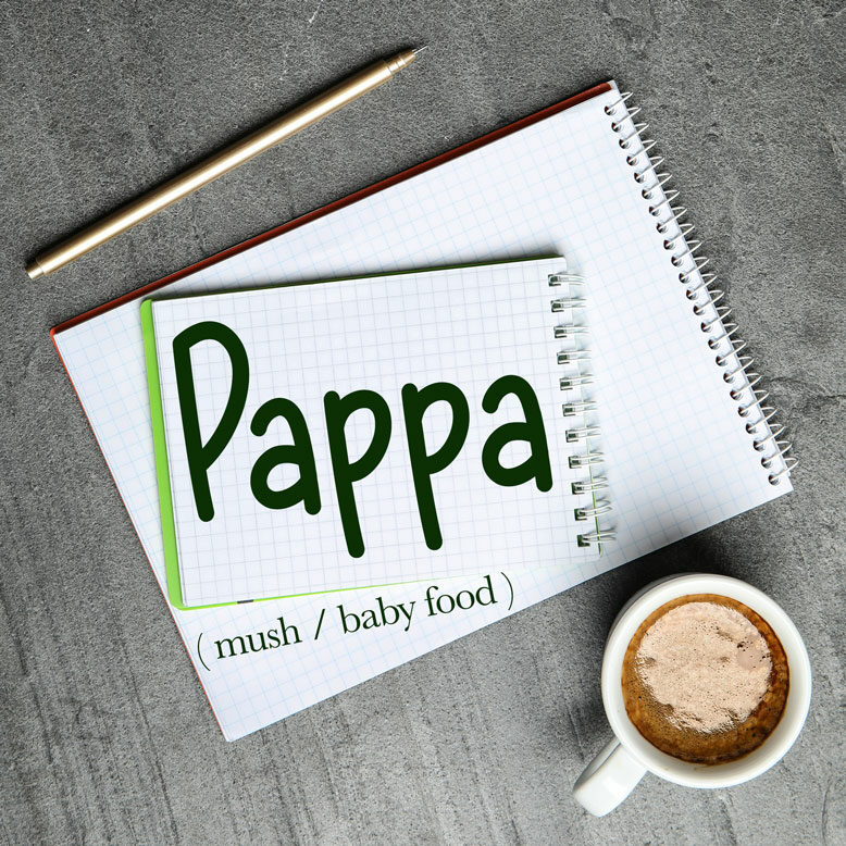 cover image with the word “pappa” and its translation written on a notepad next to a cup of cofee