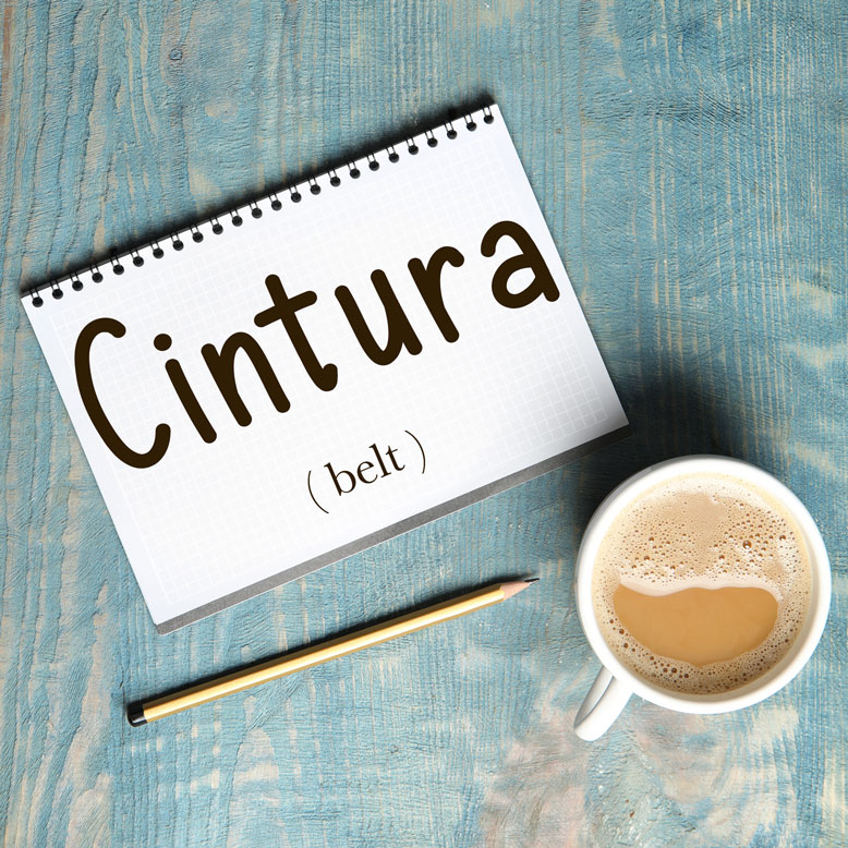 cover image with the word “cintura” and its translation written on a notepad next to a cup of coffee