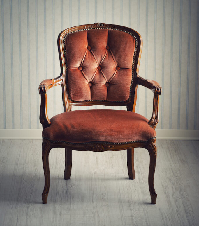 Baroque chair in an empty room