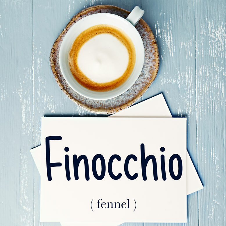 cover image with the word “finocchio” and its translation written on a notepad next to a cup of coffee
