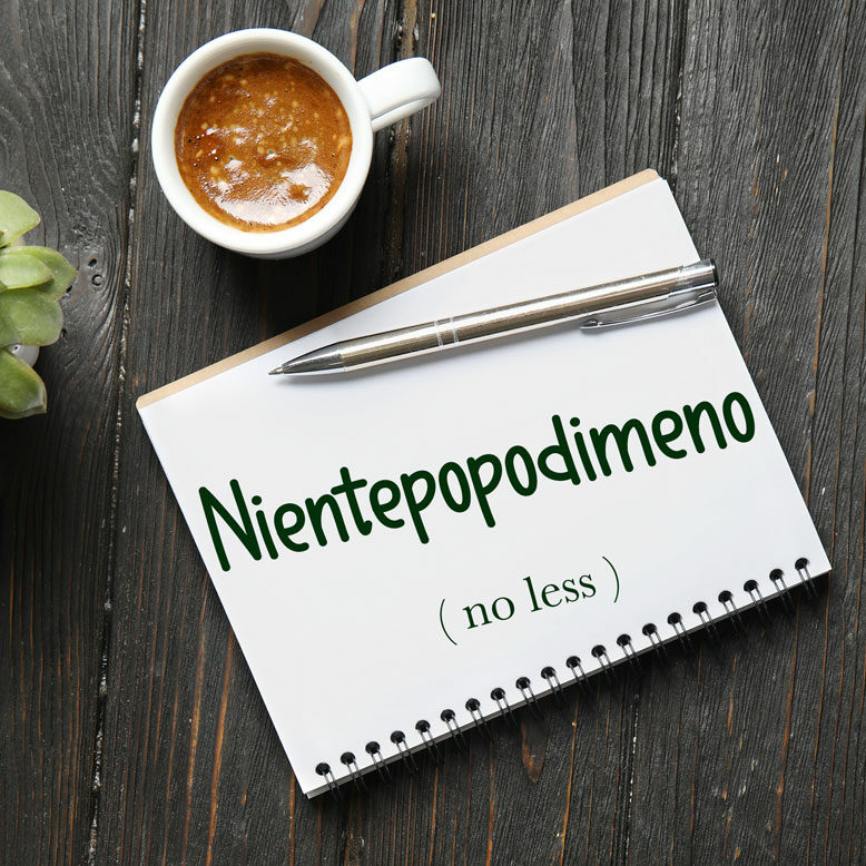 cover image with the word “nientepopodimeno” and its translation written on a notepad next to a cup of coffee