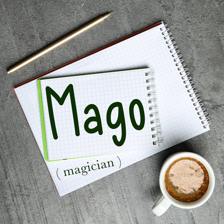 cover image with the word “mago” and its translation written on a notepad next to a cup of coffee