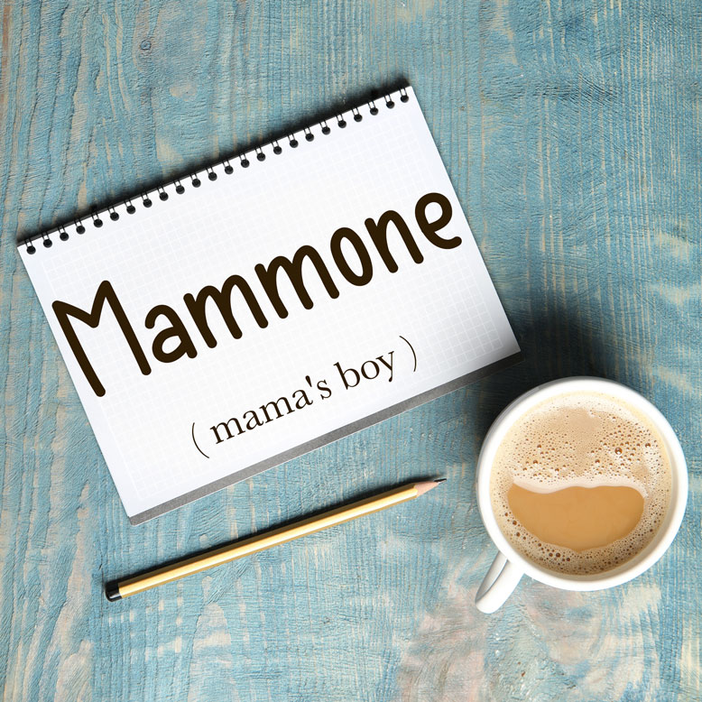 cover image with the word “mammone” and its translation written on a notepad next to a cup of coffee