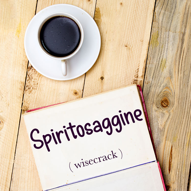 cover image with the word “spiritosaggine” and its translation written on a notepad next to a cup of coffee