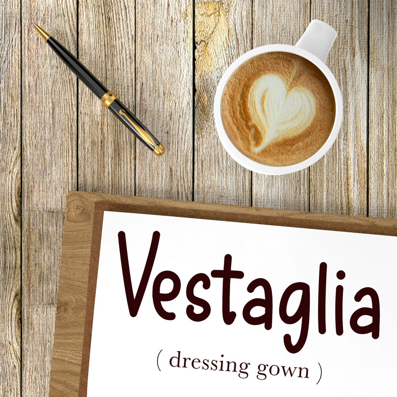 cover image with the word “vestaglia” and its translation written on a notepad next to a cup of coffee