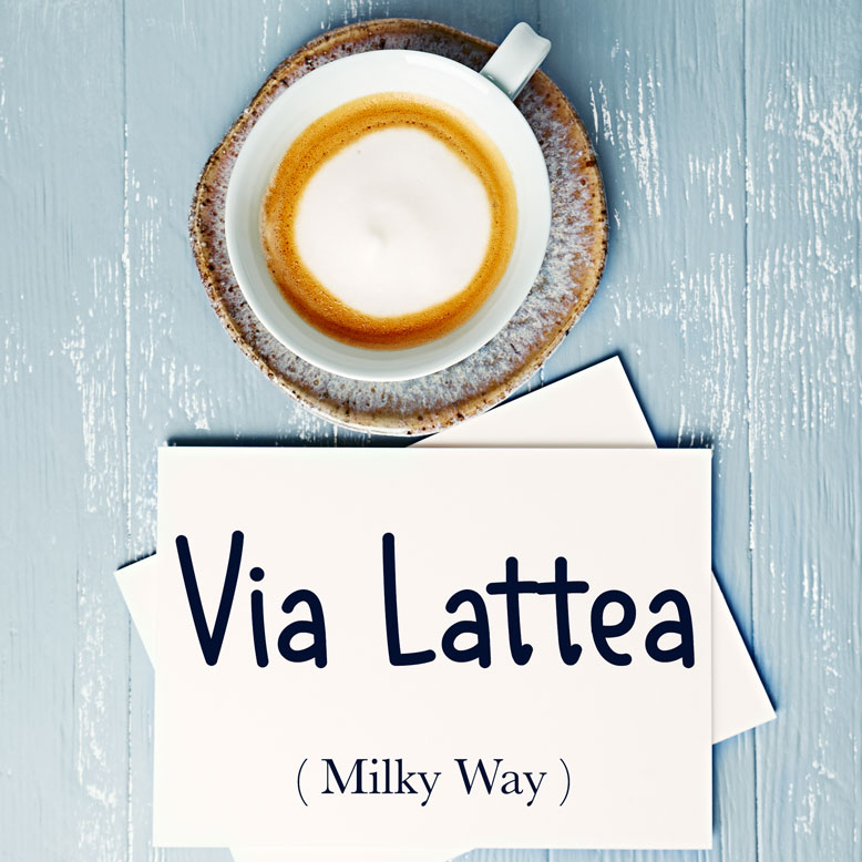 cover image with the word “Via Lattea” and its translation written on a notepad next to a cup of coffee