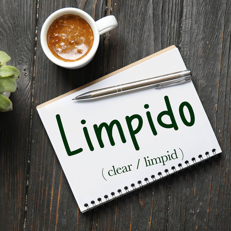 cover image with the word “limpido” and its translation written on a notepad next to a cup of coffee