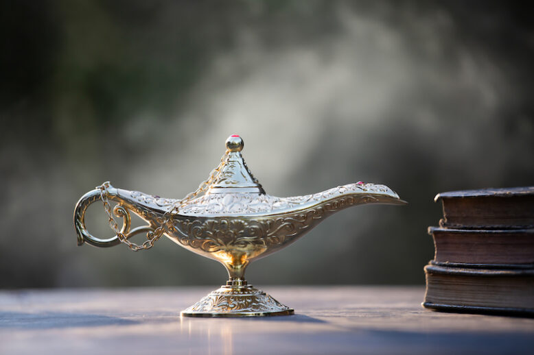 Magic lamp from the story of Aladdin in smoke.