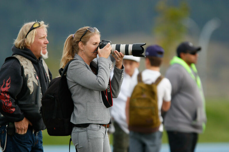 Female sports photographer on the sideline