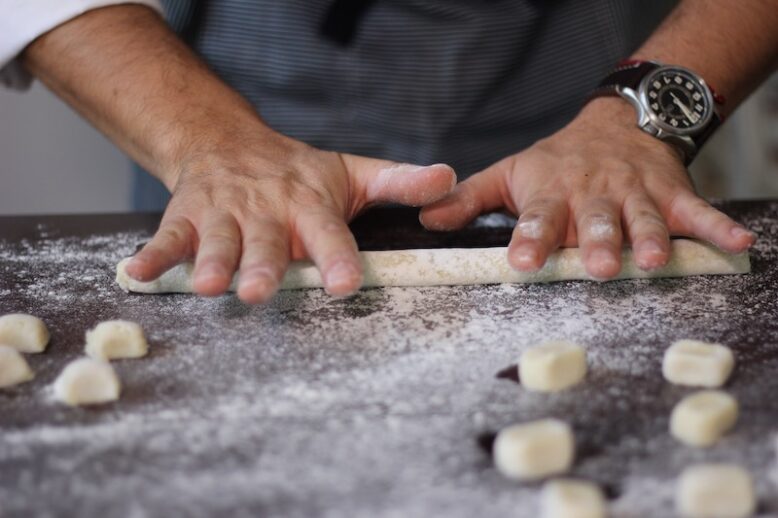 male hands preparing the gnocchi doe