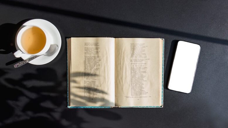 book of poems, smartphone and coffee