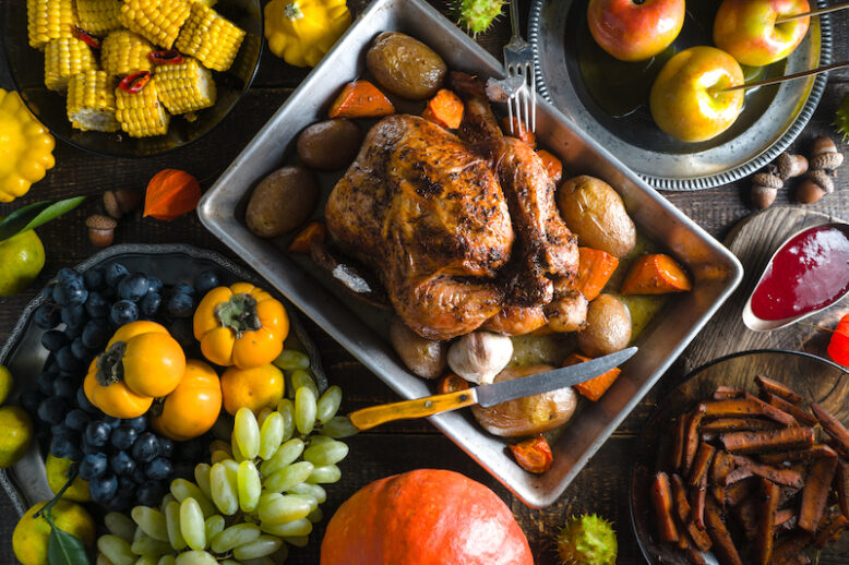 Feast with turkey on Thanksgiving, vegetables and fruit