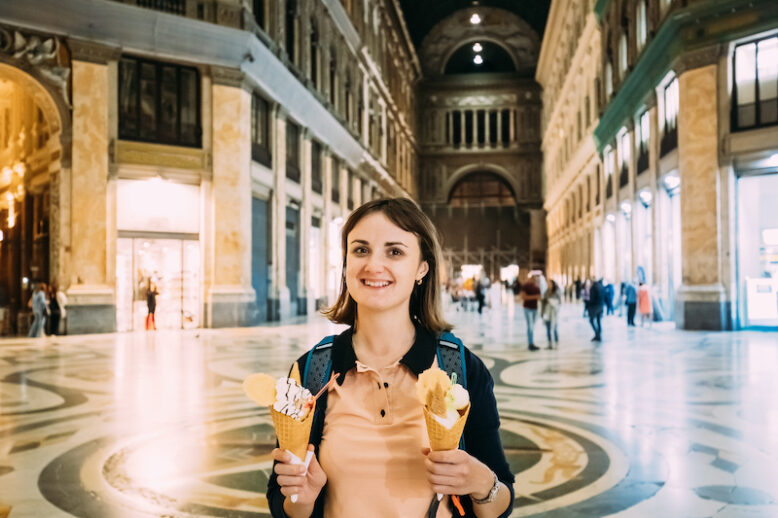 Happy Smiling Young Woman With Ice-cream In Hands In Galleria Umberto I.
