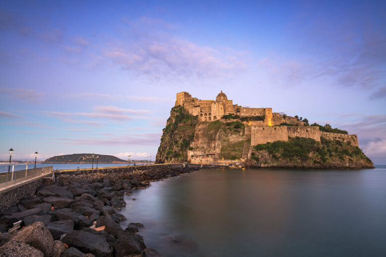 Ischia, Italy with Aragonese Castle in the Mediterranean at dawn.