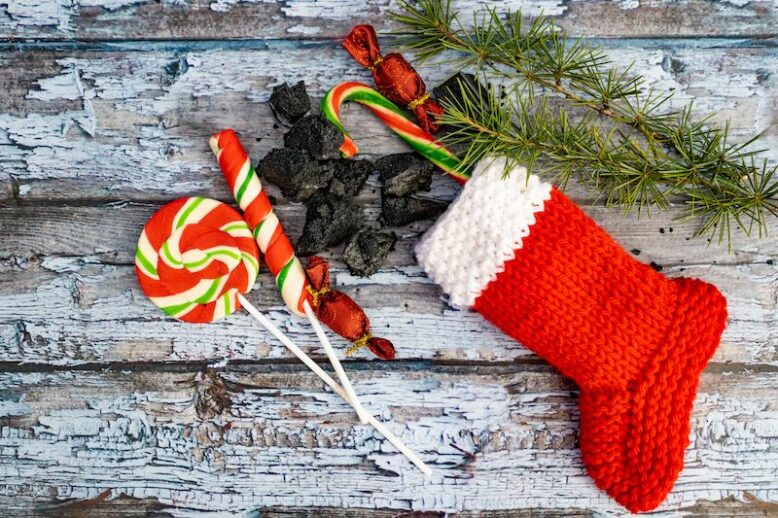 A composition with sweet coals, stockings and candies from la Befana