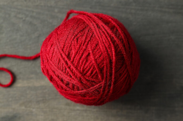 Red ball of yarn.