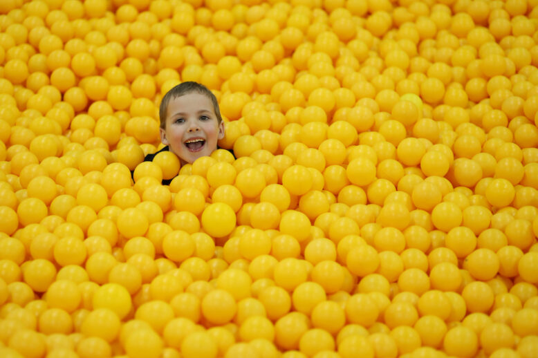 boy in ball pit