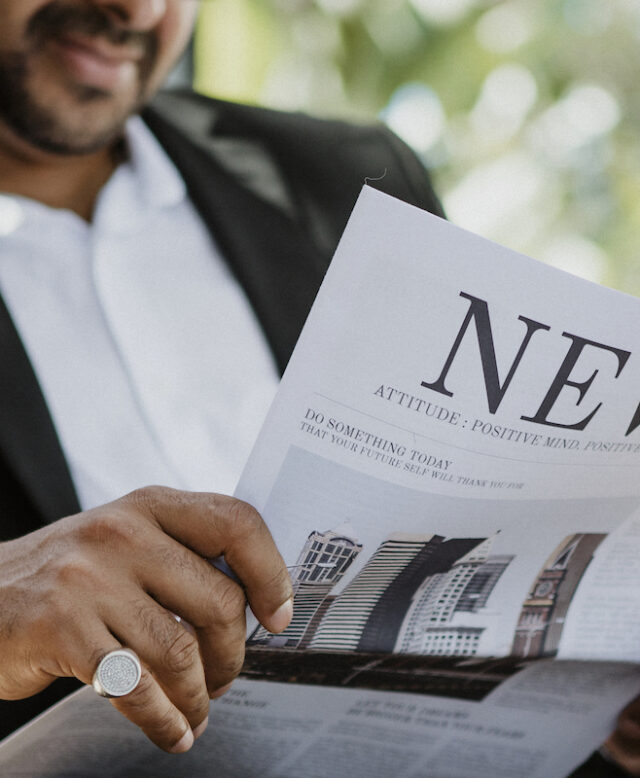 Businessman reading a newspaper in a cafe