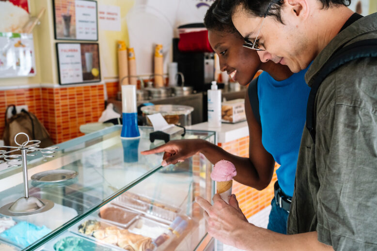 couple choosing a ice cream in a shop