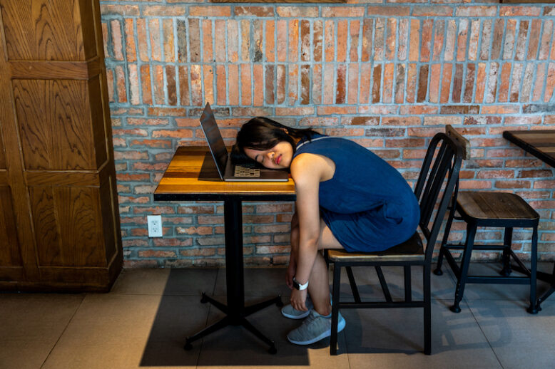 girl sleeping at desk
