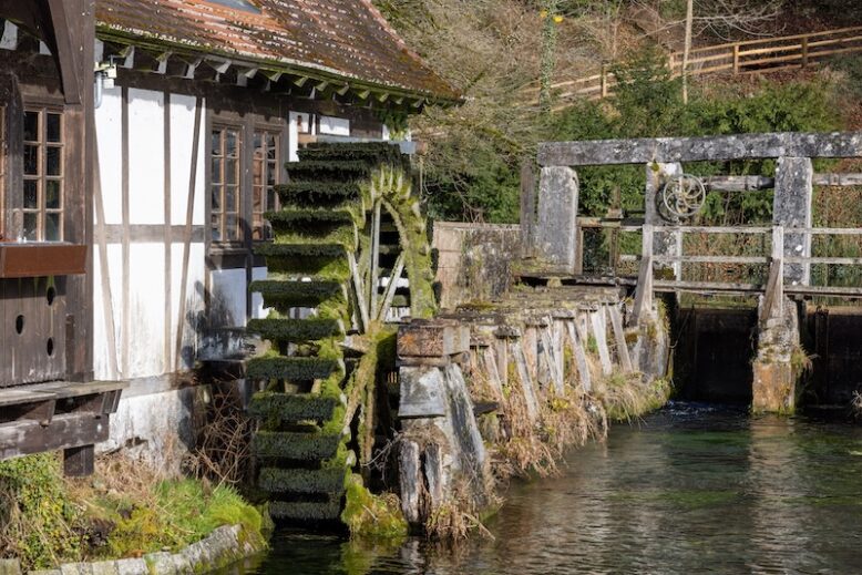 View of a half-timbered watermill at the Blautopfsee in Blaubeuren a day in spring