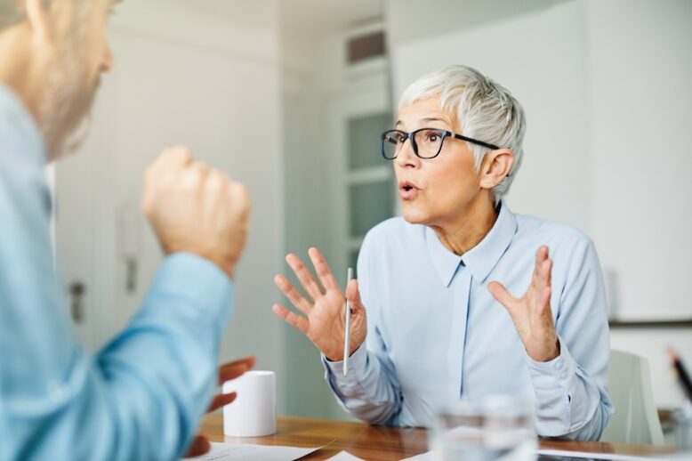 man and woman discussing something intensely